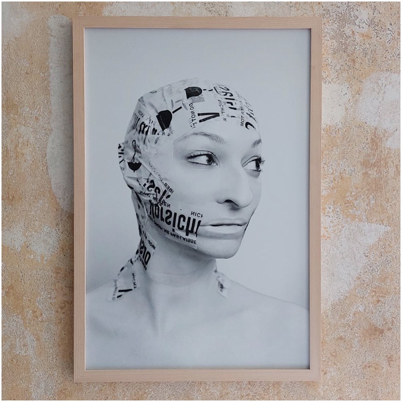 Print from the series Caged (Original german title: Befangen). Tapelifted face without wig in black an white.